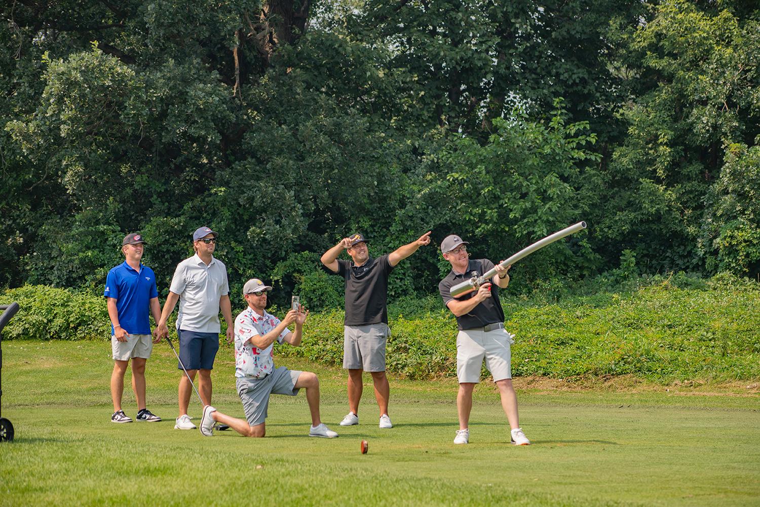 photo of a foursome team member using Air powered launcher